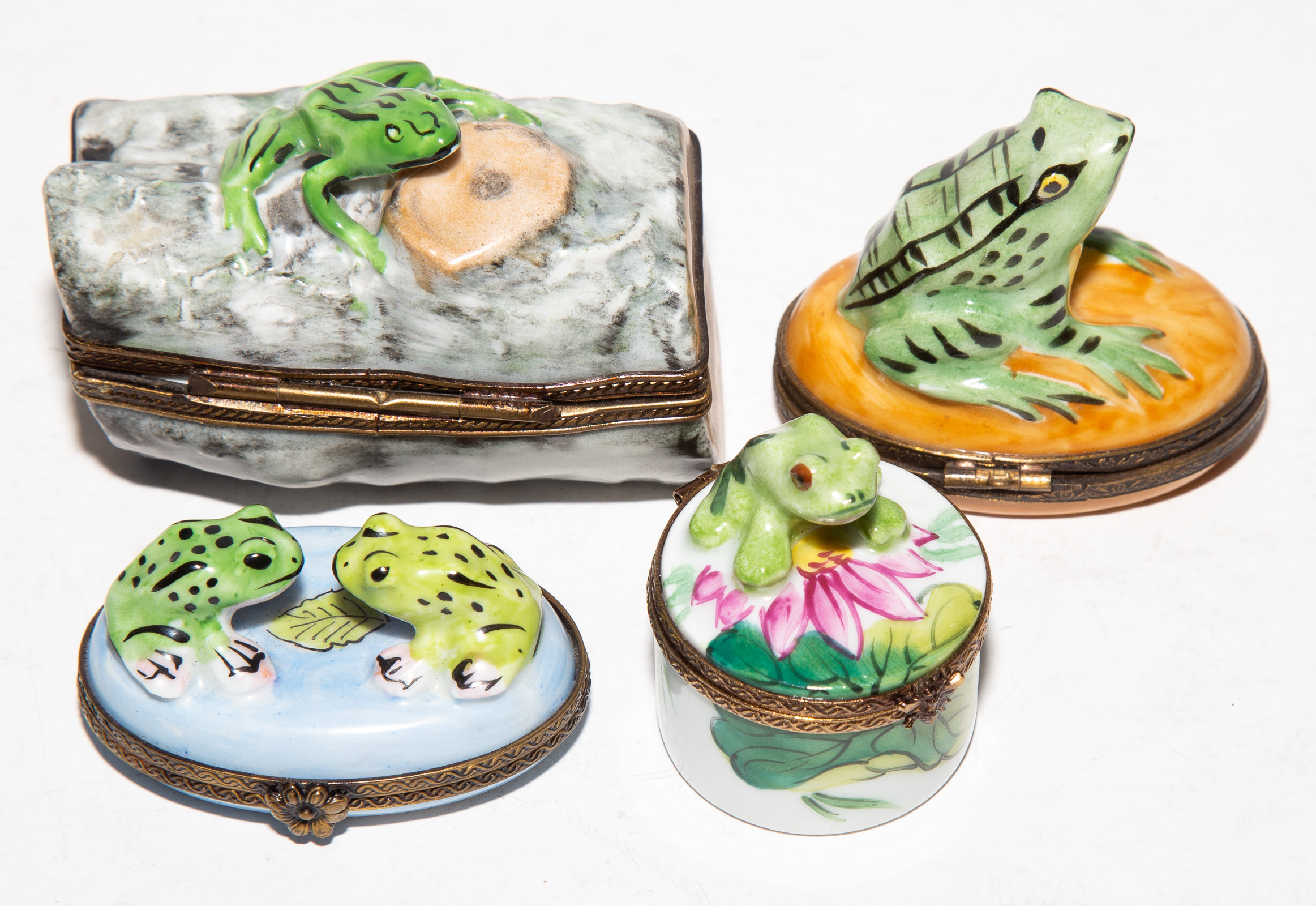 FOUR LIMOGES PORCELAIN BOXES WITH