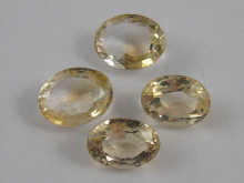 Four loose polished citrines