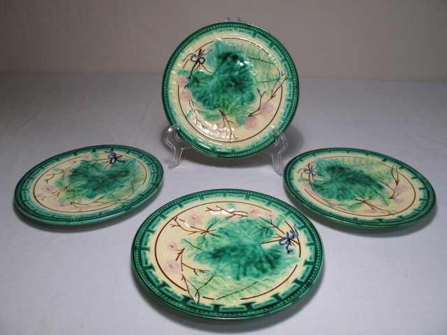 Four Majolica pottery plates in the