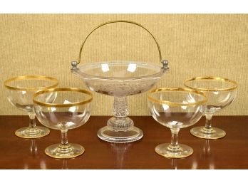 Four matching gilt decorated footed