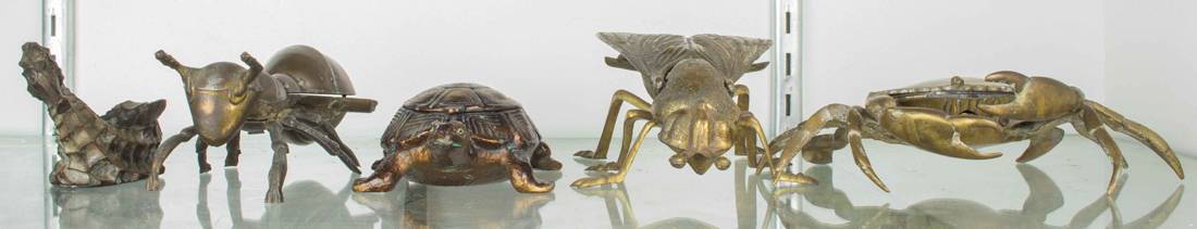 FOUR METAL FIGURAL ASHTRAYS Four