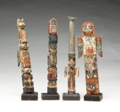 FOUR MINIATURE TOURIST TOTEM P