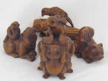 Four modern hardwood netsuke all