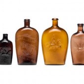 Four Molded Glass Amber Flasks