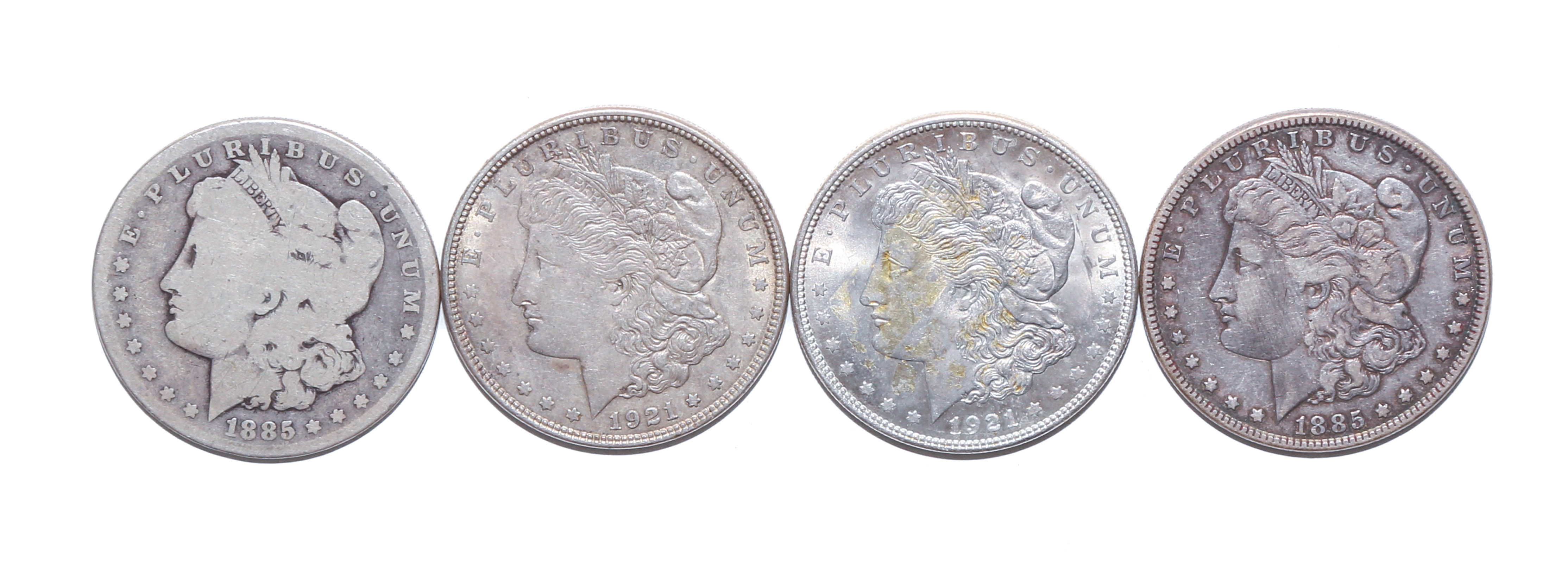 FOUR MORGAN SILVER DOLLARS 1885