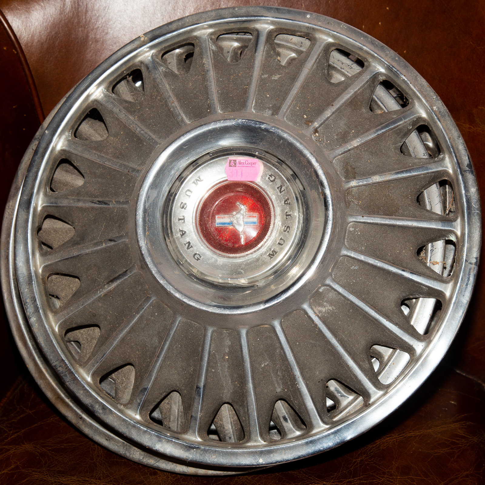 FOUR MUSTANG HUBCAPS *located in