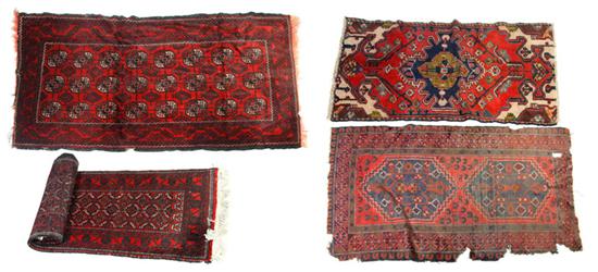 FOUR ORIENTAL RUGS.  Twentieth