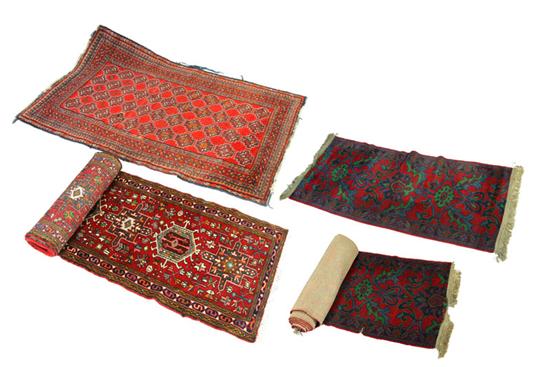 FOUR ORIENTAL RUGS.  Twentieth