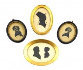 FOUR OVAL FRAMED SILHOUETTES,