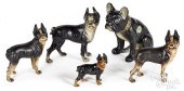 FOUR PAINTED CAST IRON DOG DOO