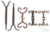 FOUR PAIRS OF WROUGHT IRON HIN