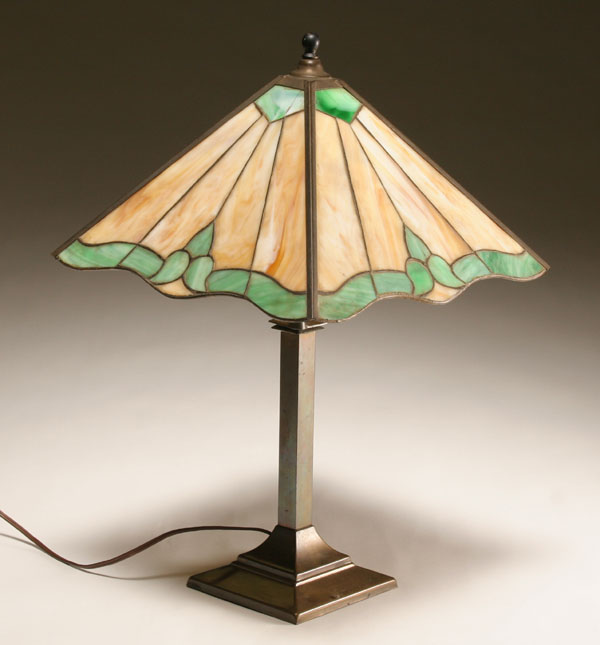 Four panel slag glass table lamp.