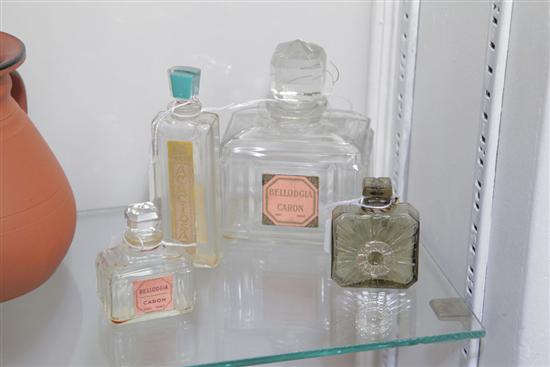 FOUR PERFUME BOTTLES. Including one