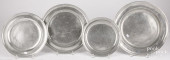FOUR PEWTER PLATES/CHARGERS, 1