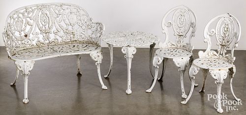FOUR PIECE CAST IRON PATIO SET,