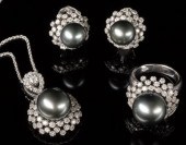 Four-Piece Fourteen-Karat Whit