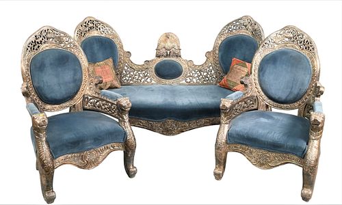 FOUR PIECE SILVERED REPOUSSE