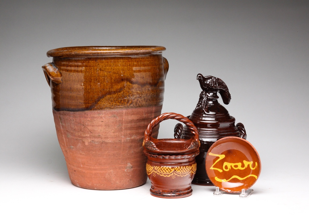 FOUR PIECES OF AMERICAN REDWARE.