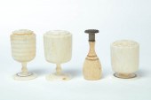 FOUR PIECES OF CARVED BONE AND