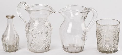 FOUR PIECES OF COLORLESS GLASS,