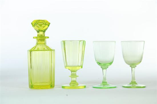 FOUR PIECES OF VASELINE GLASS. 