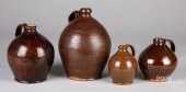 FOUR REDWARE JUGS, 19TH C.Four