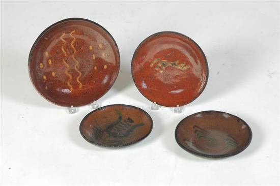 FOUR REDWARE PLATES.  American  mid