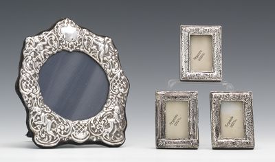 Four Repousse Silver Picture Frames