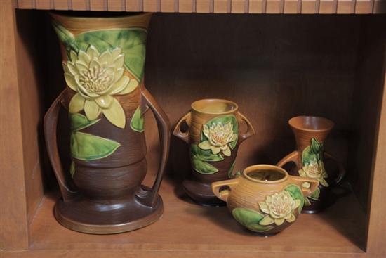 FOUR ROSEVILLE POTTERY VASES. All