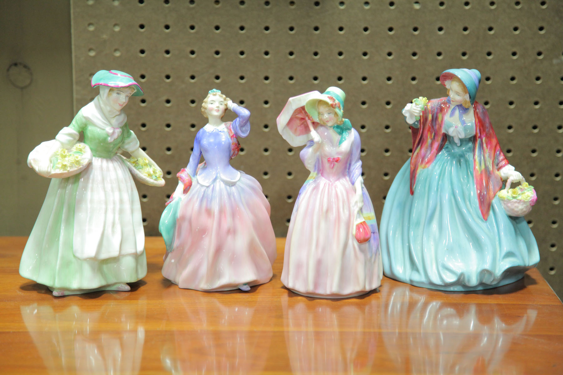 FOUR ROYAL DOULTON FIGURES. 