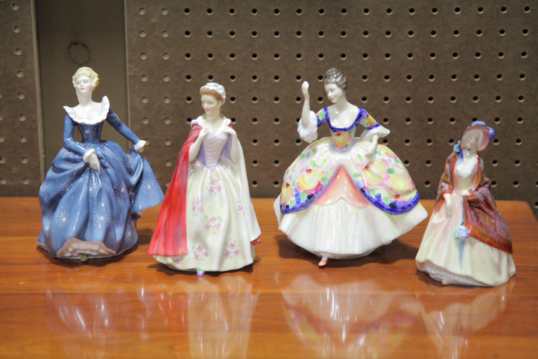 FOUR ROYAL DOULTON FIGURES. 