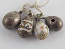 Four Russian silver egg pendants