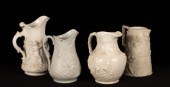 Four saltware jugs, decorated