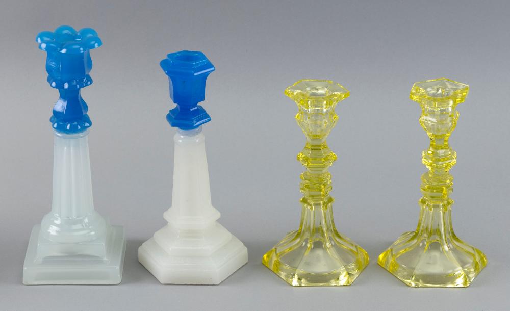 FOUR SANDWICH GLASS CANDLESTICKS