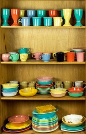 FOUR SHELVES OF ART POTTERY, M
