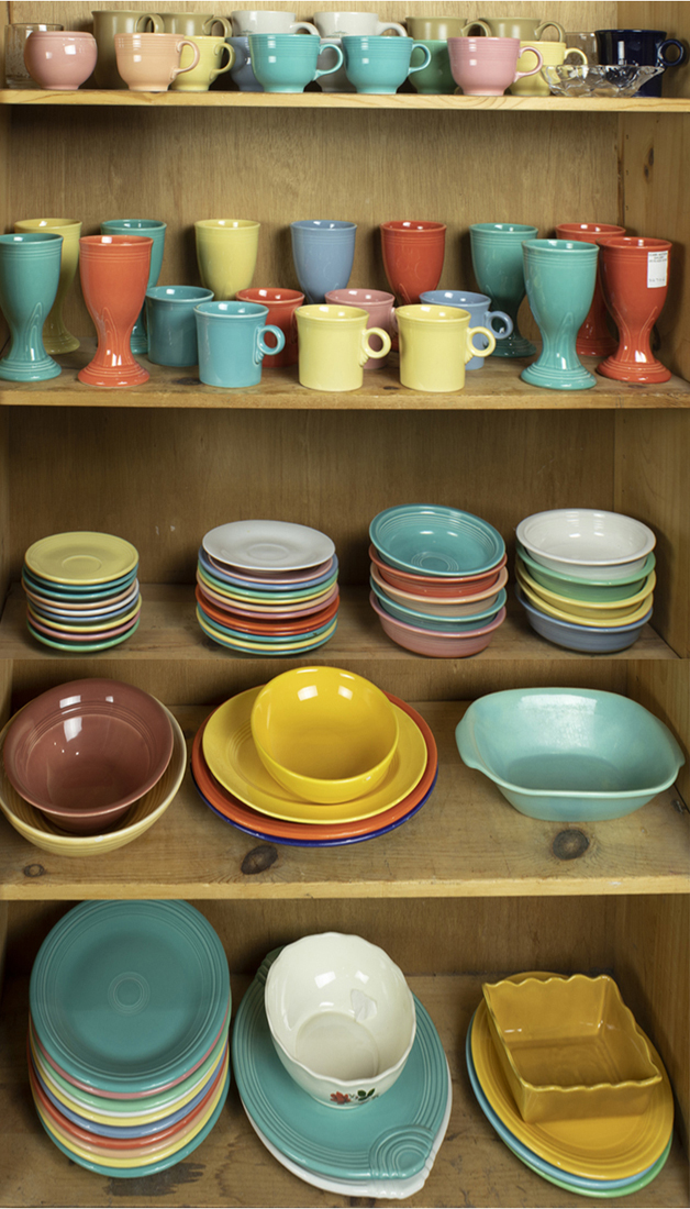 FOUR SHELVES OF ART POTTERY, MOSTLY