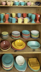FOUR SHELVES OF ART POTTERY, M