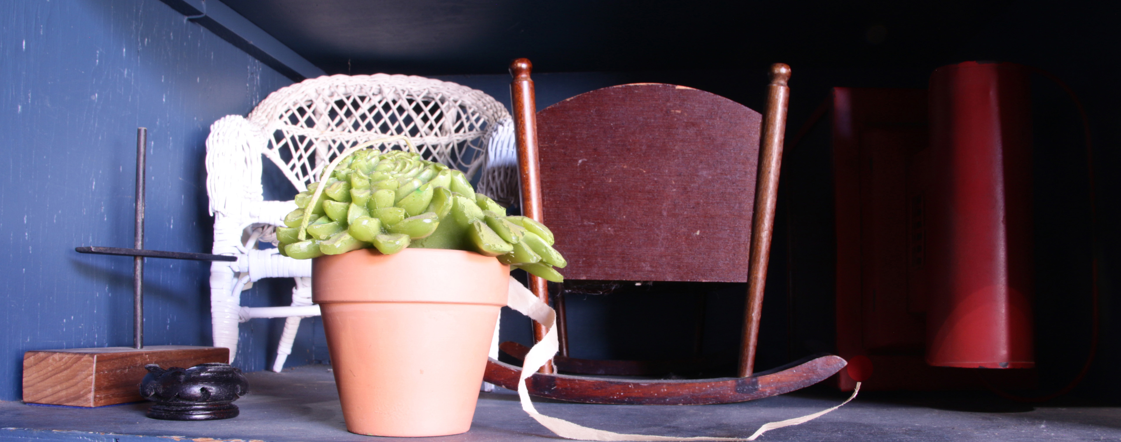 FOUR SHELVES OF FOLK ART AND