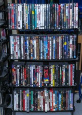 FOUR SHELVES OF MOVIES ON DVD