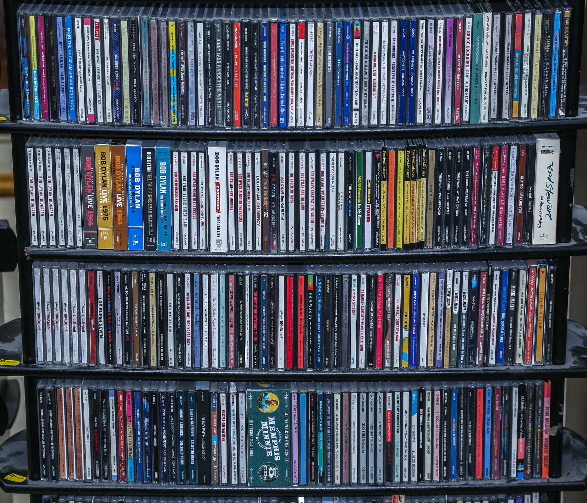 FOUR SHELVES OF MUSICAL CDS