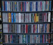 FOUR SHELVES OF MUSICAL CDS Pr