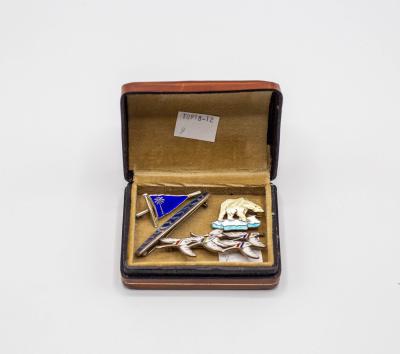 Four silver and enamel brooches