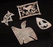 Four silver brooches including