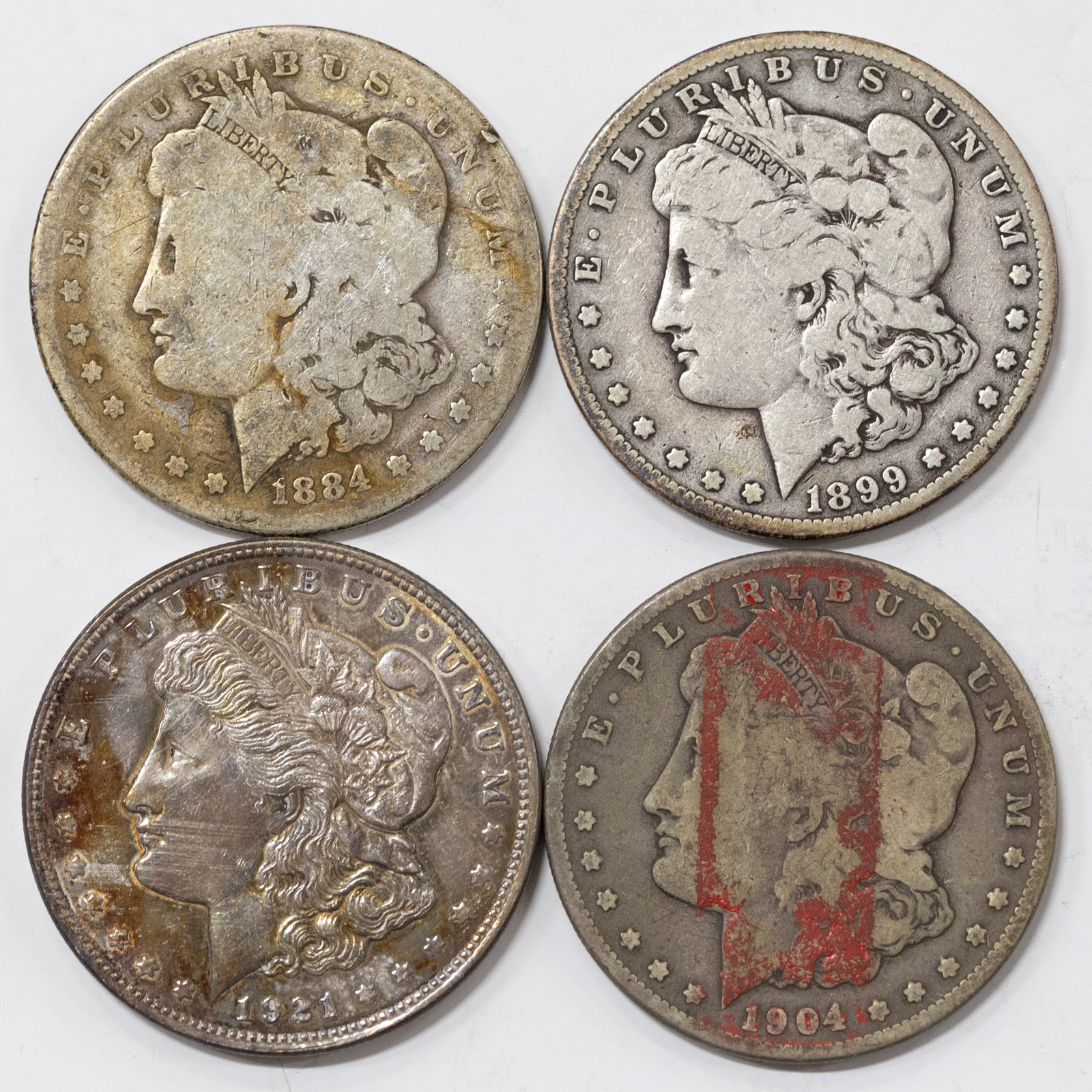 FOUR SILVER DOLLARS 1884 AG/G,