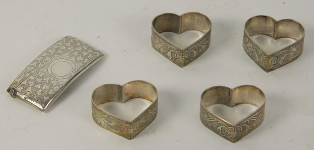 Four silver heart shaped napkin