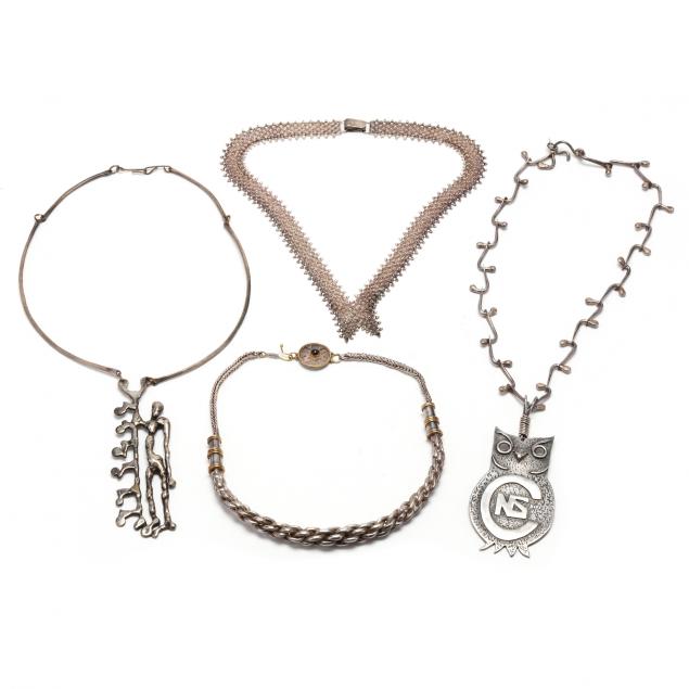 FOUR SILVER NECKLACES To include: a
