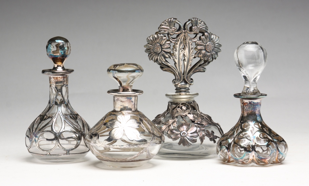 FOUR SILVER OVERLAY PERFUMES.