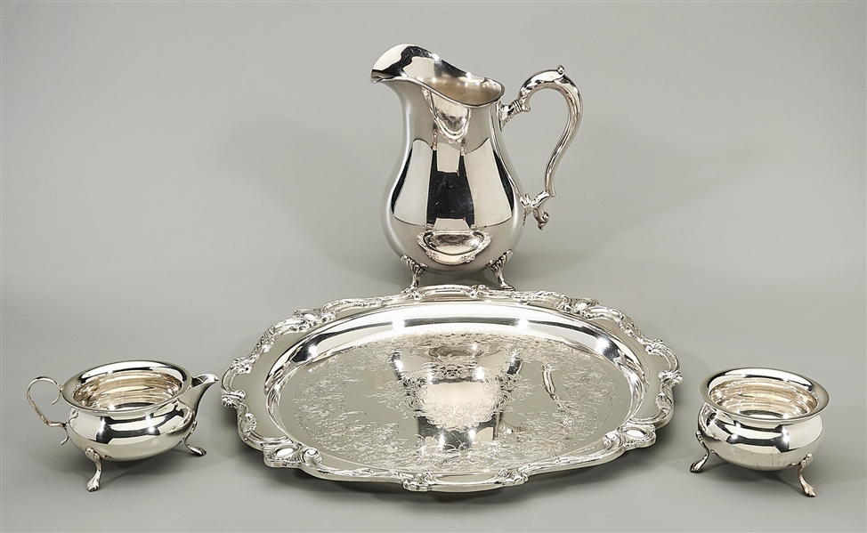Four silver plate service items;