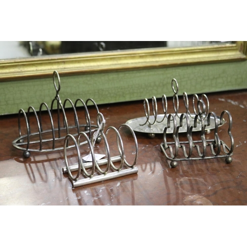 Four silver plate toast racks,