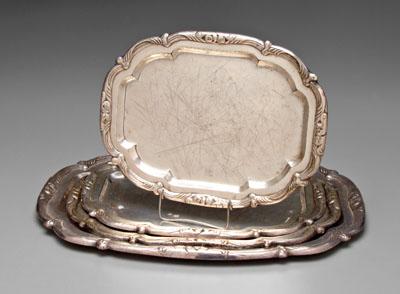 Four silver-plate trays: rounded